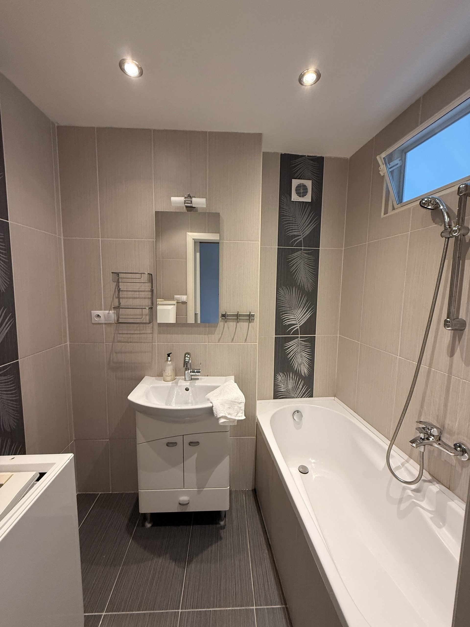 Bathroom with bathtub and shower