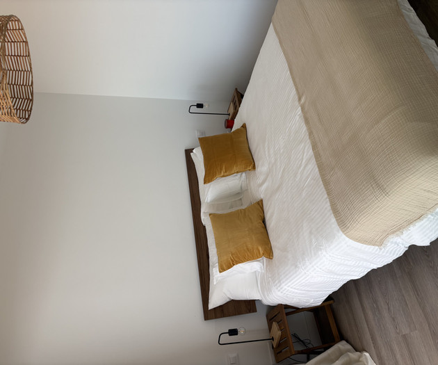 Bedroom bed with wooden headboard