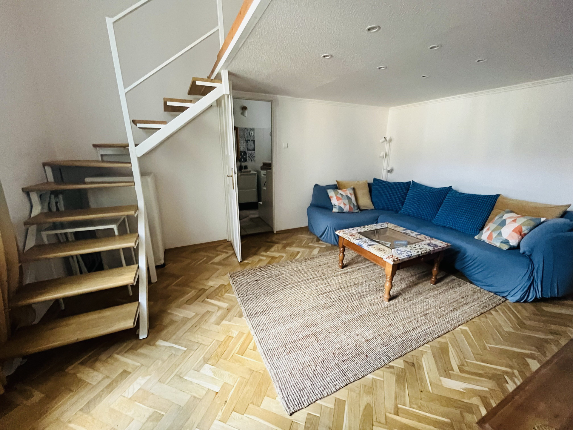 Living room with sofa and staircase
