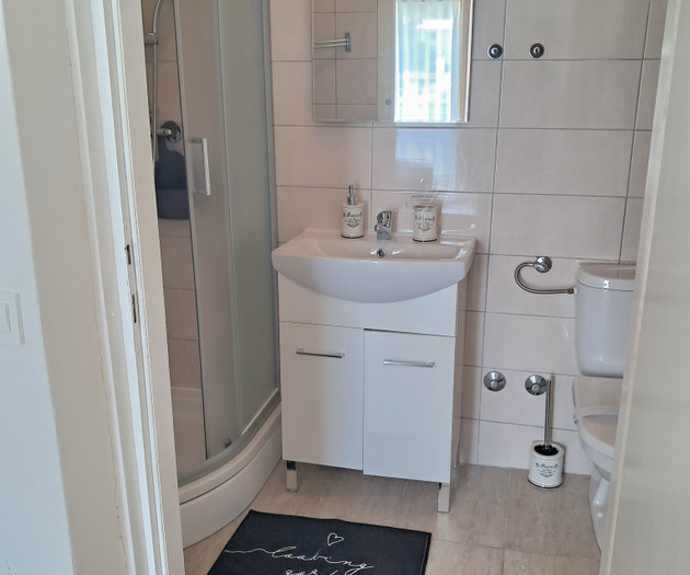 Bathroom with shower and sink