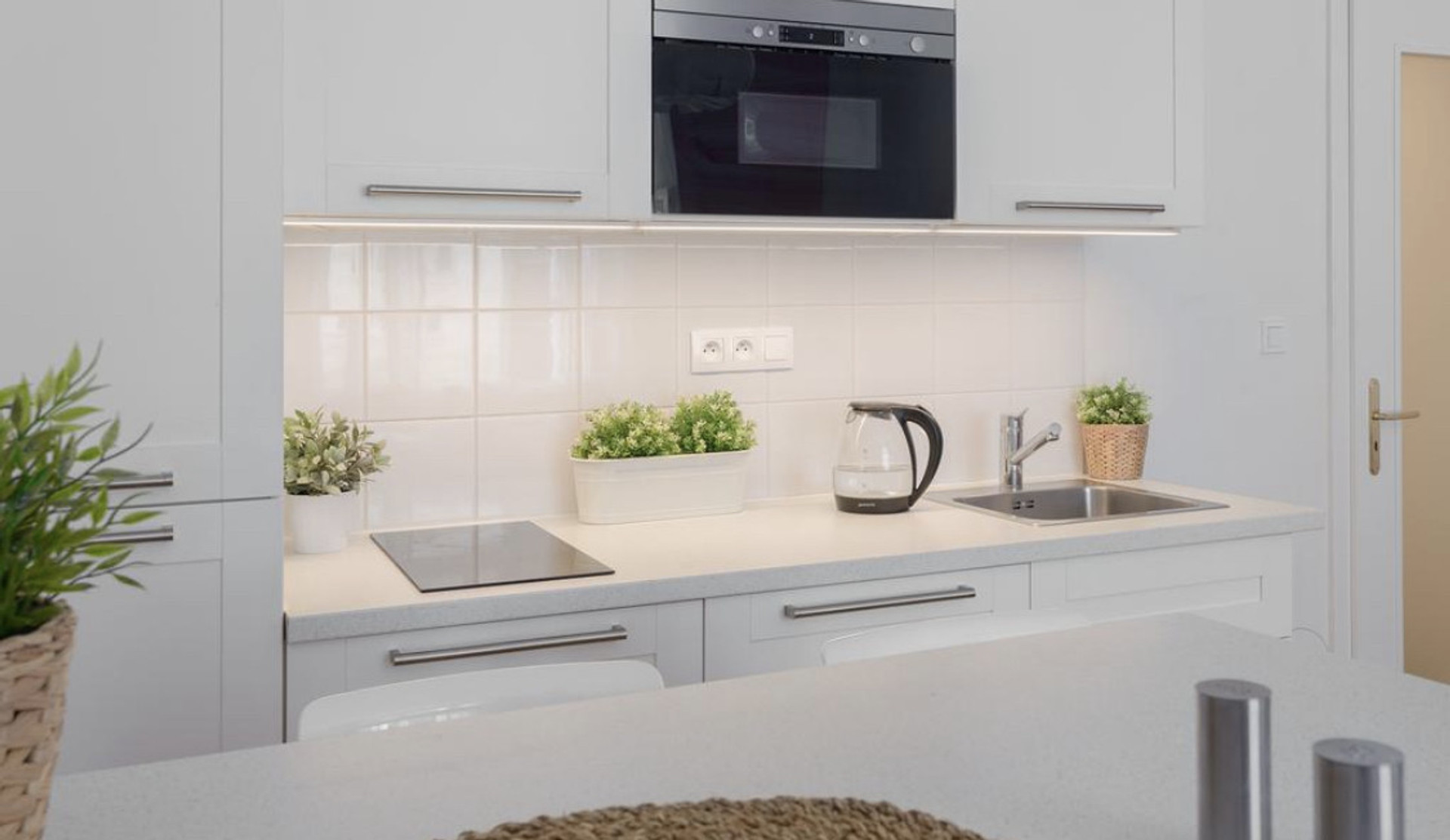 White kitchen with modern appliances
