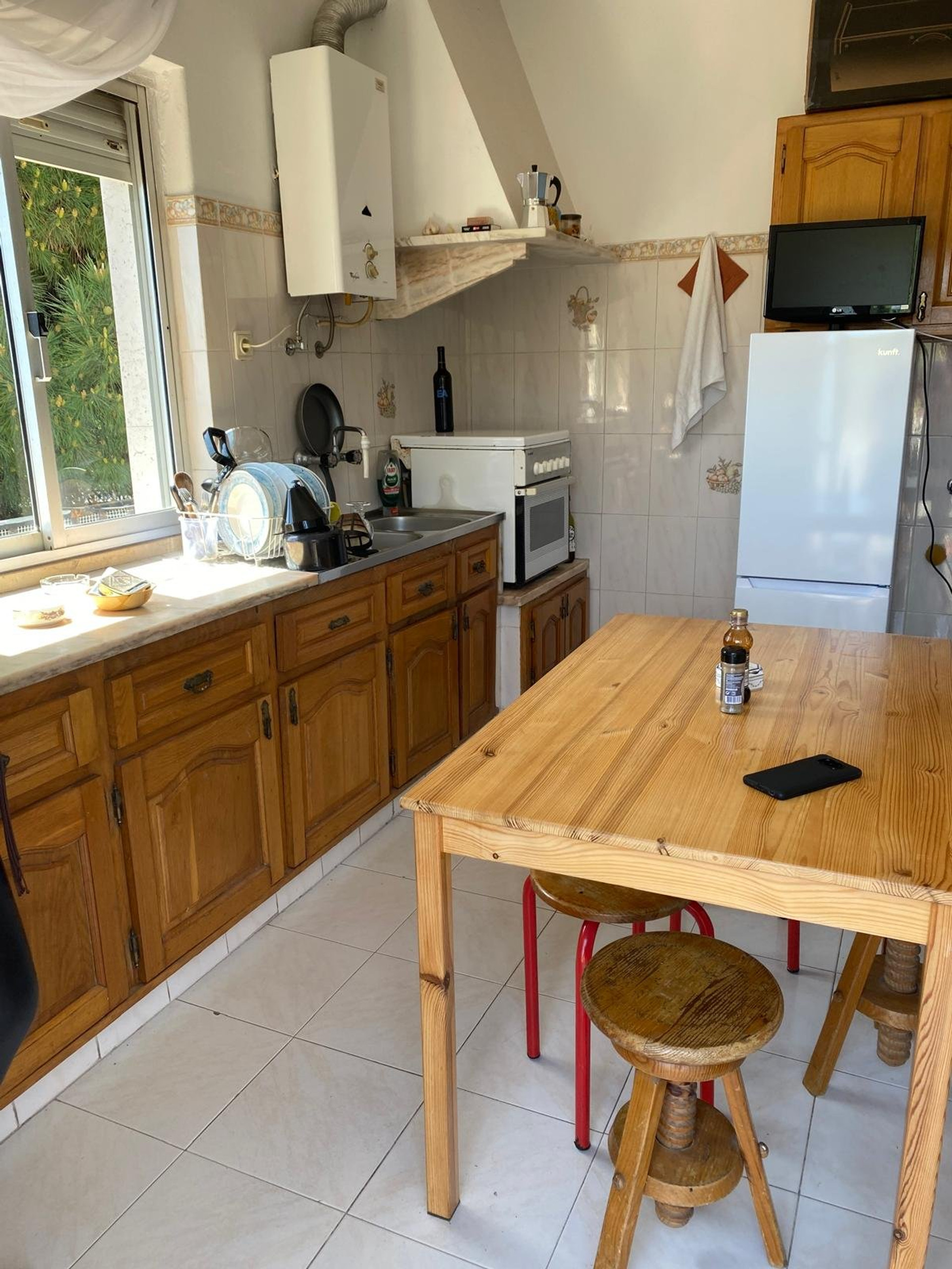 Full kitchen with wooden cabinets
