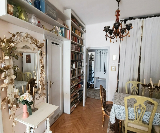 Hallway with bookshelf and mirror