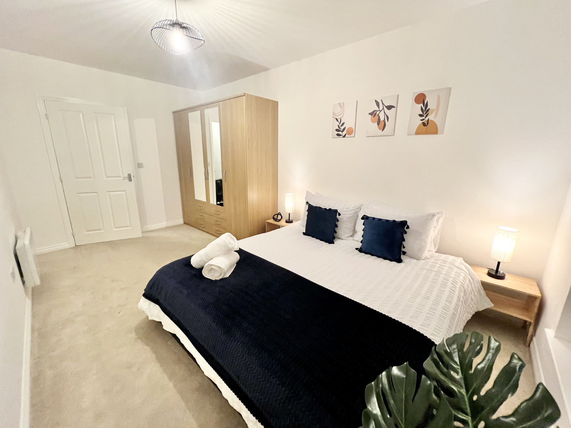 Bedroom 1: Large wardrobe with drawers for clothes storage