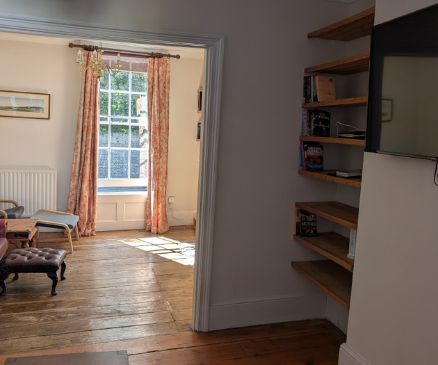 Living room view with bookshelf
