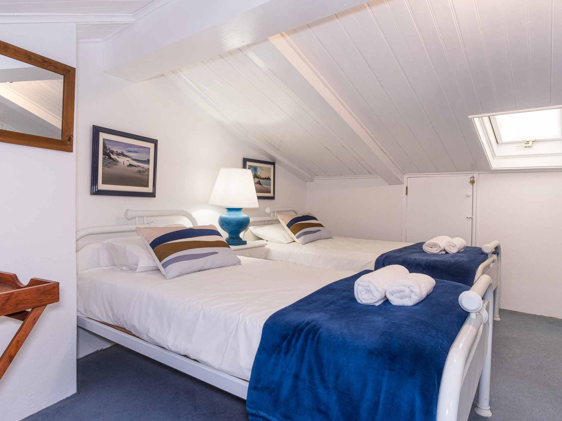 Attic twin bedroom with skylight