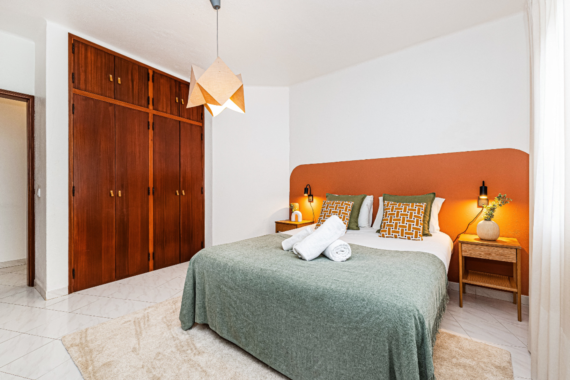 Bedroom with terracotta headboard
