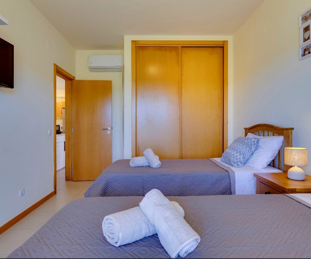Twin bedroom with wardrobe