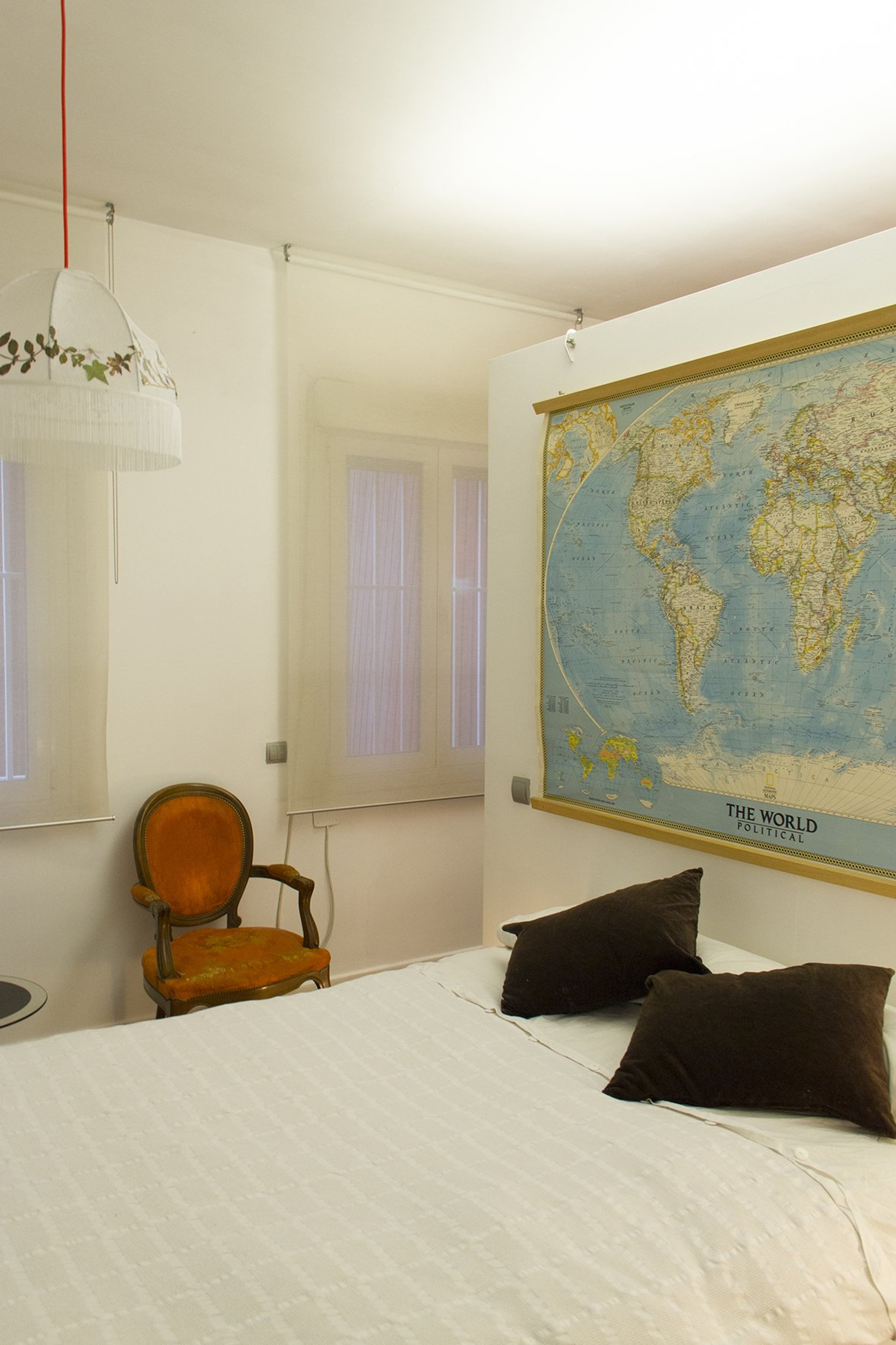 Bedroom with world map decor