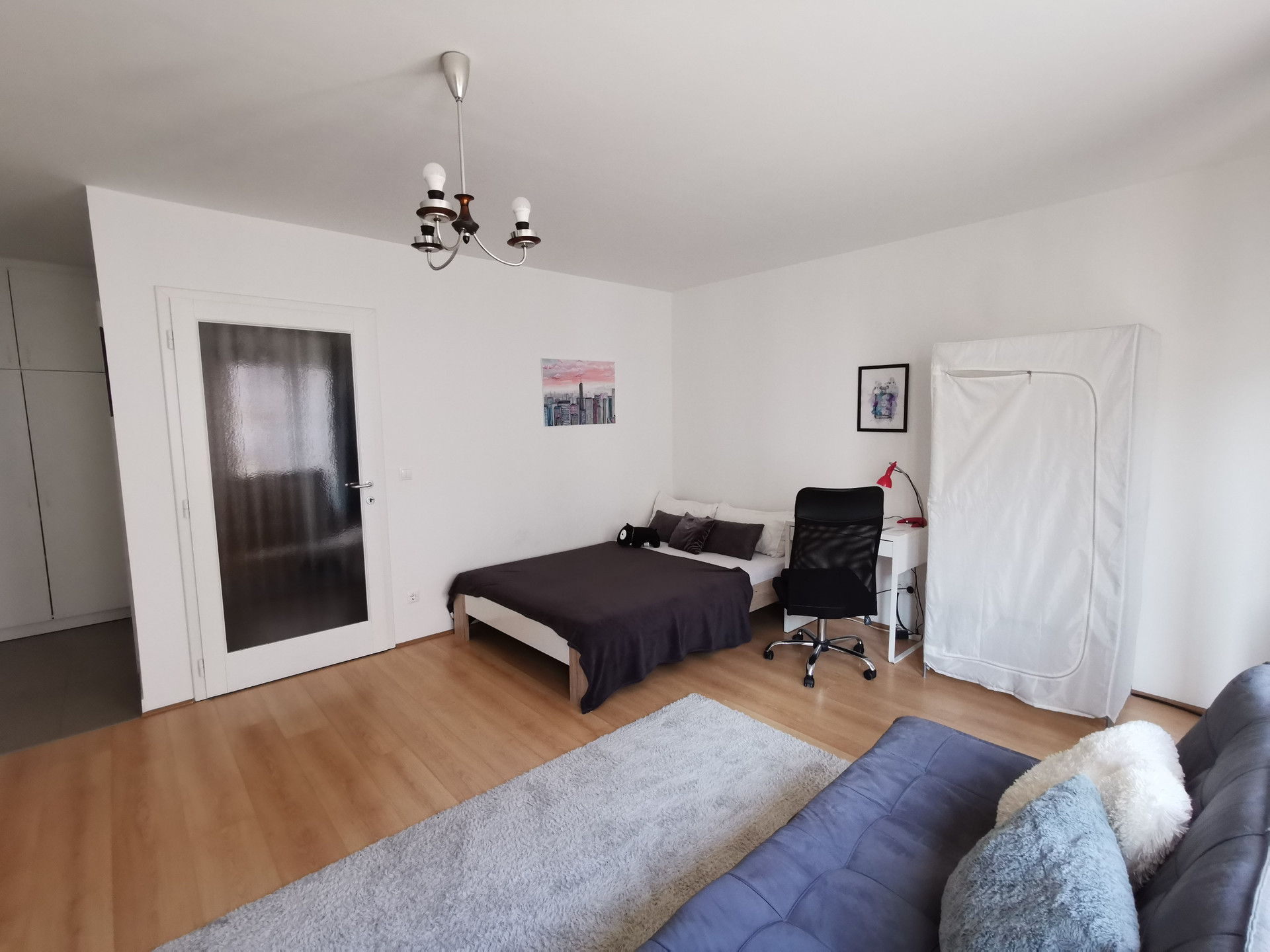 Bedroom area with sofa