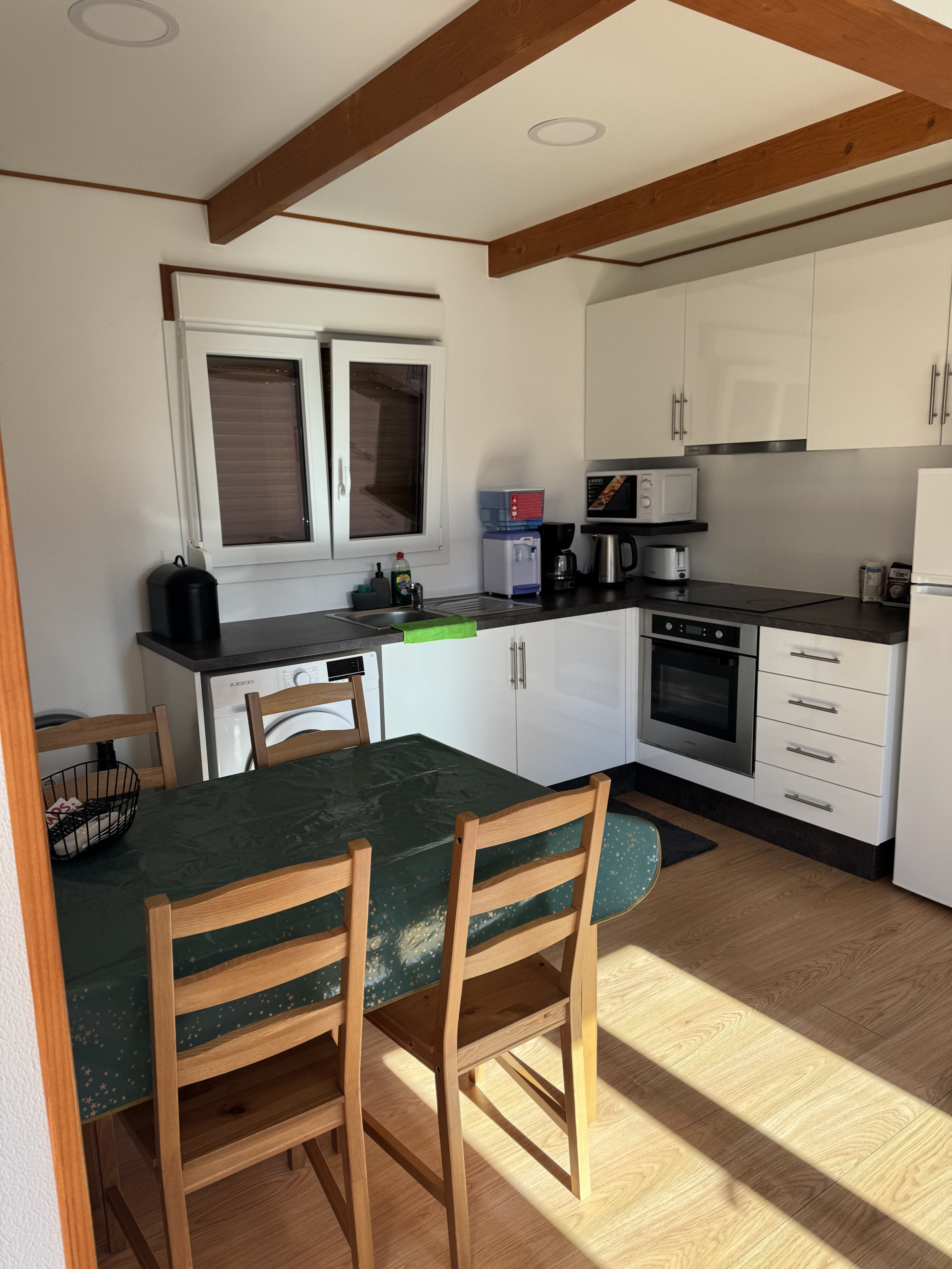 Kitchen with oven and dining table