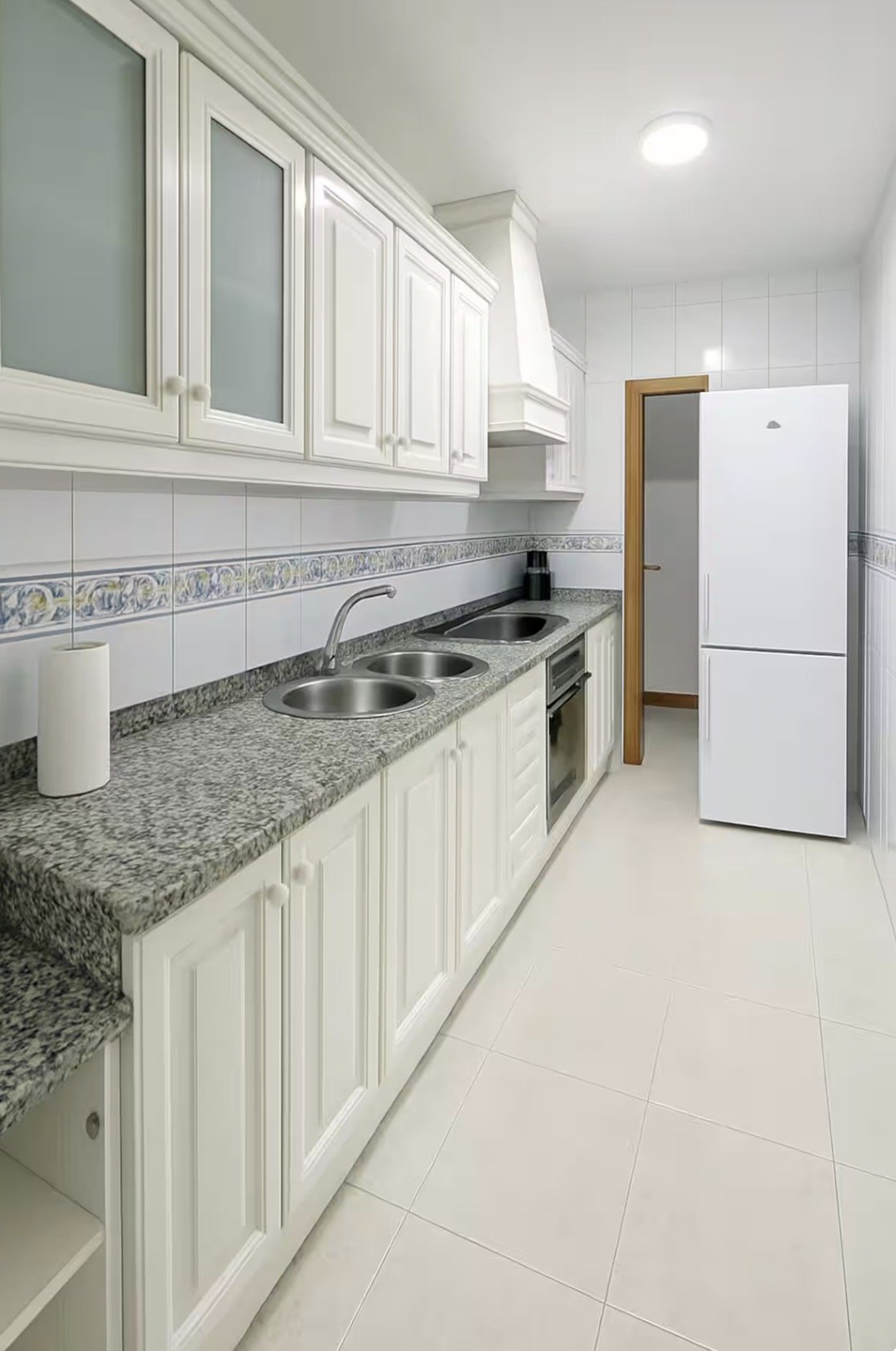 Bright kitchen with white cabinets