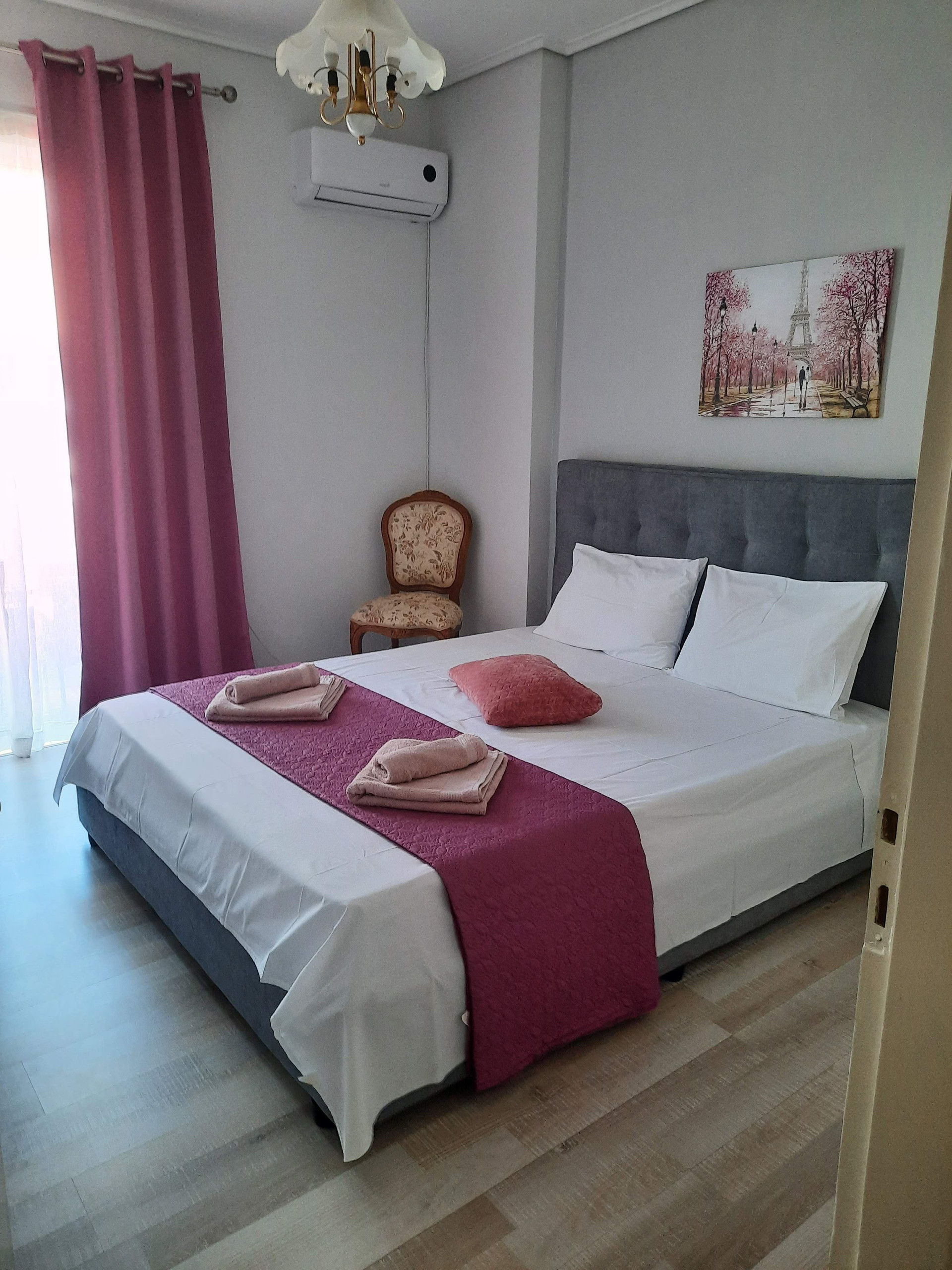 Bedroom with pink bedspread