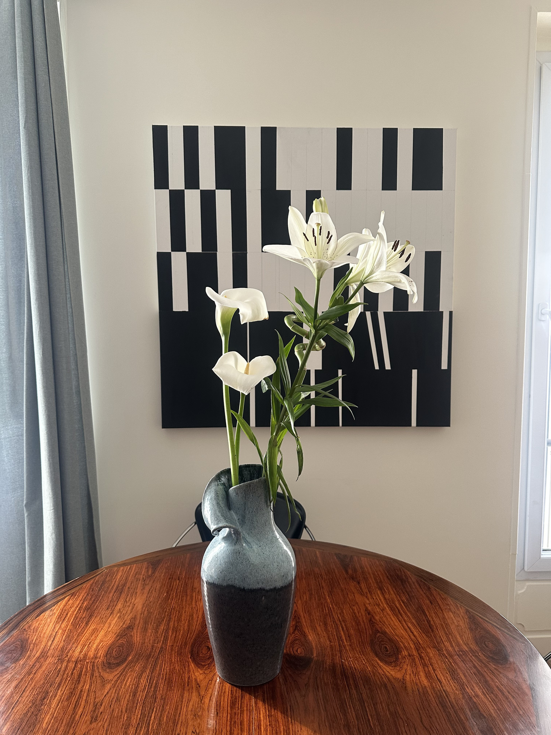 Dining table with flowers and artwork