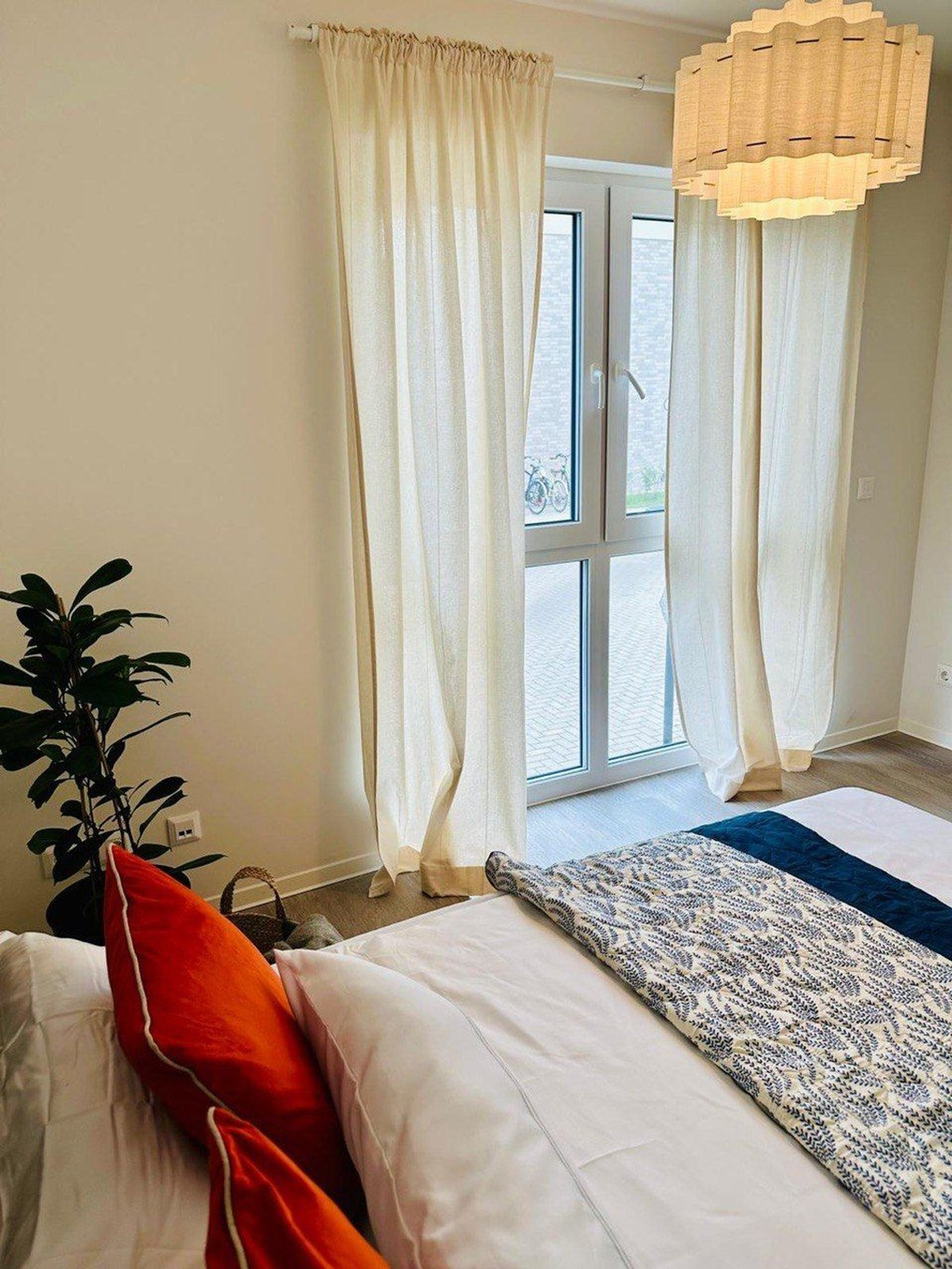 Bright bedroom with large window