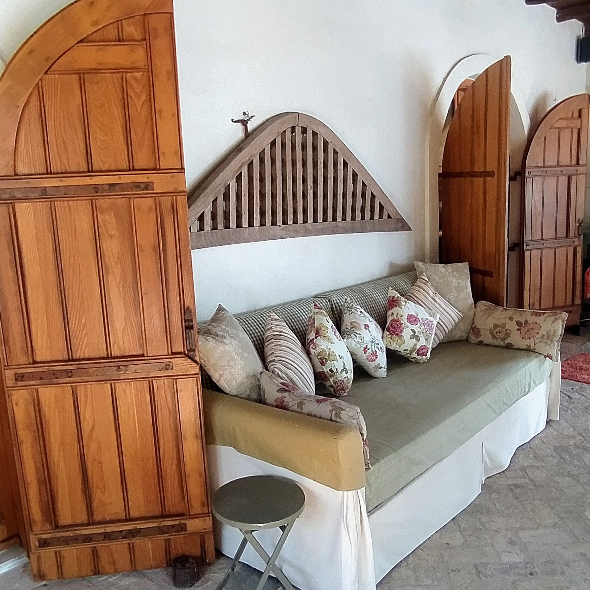 Daybed with cushions and wooden doors