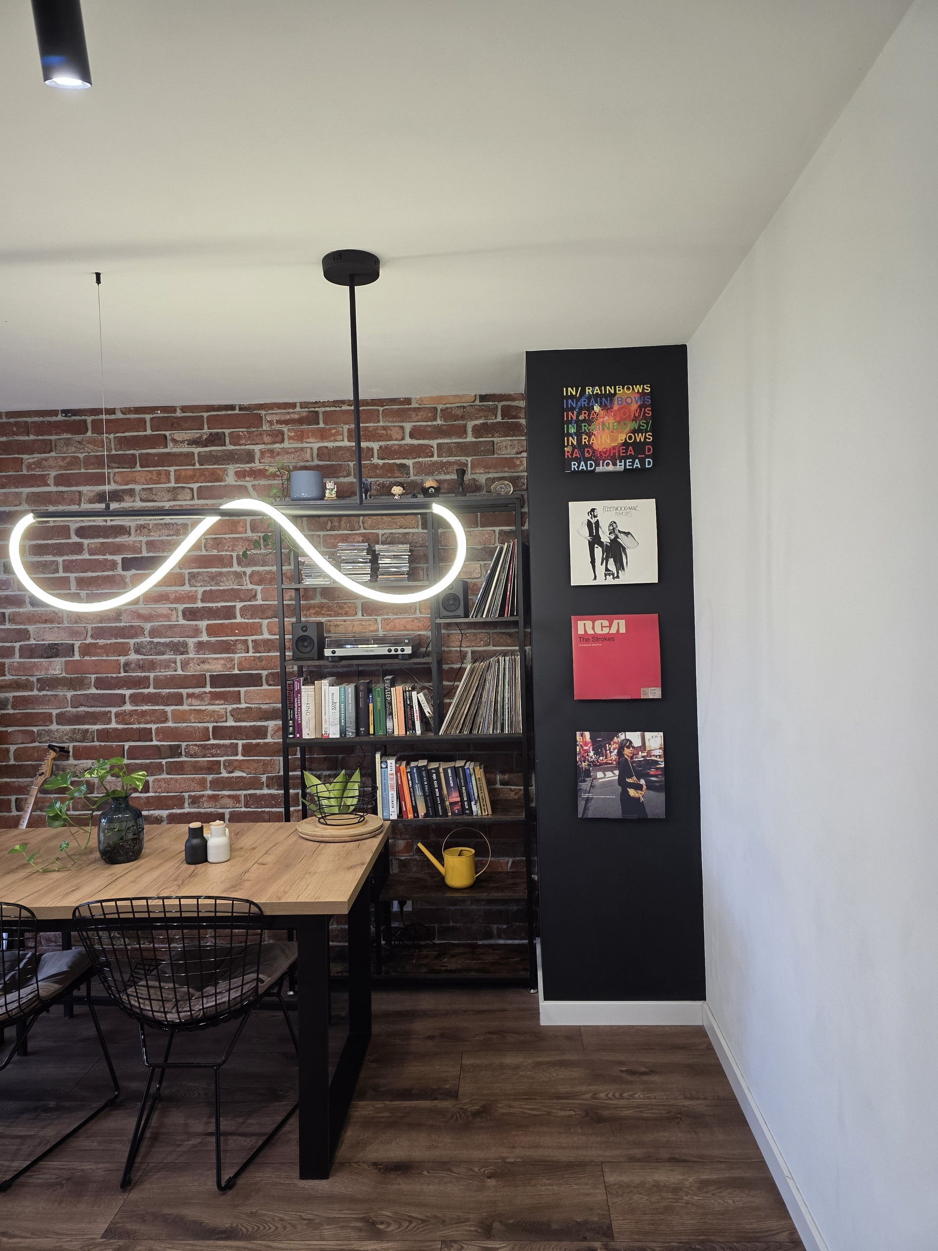 Living room with brick wall and shelves