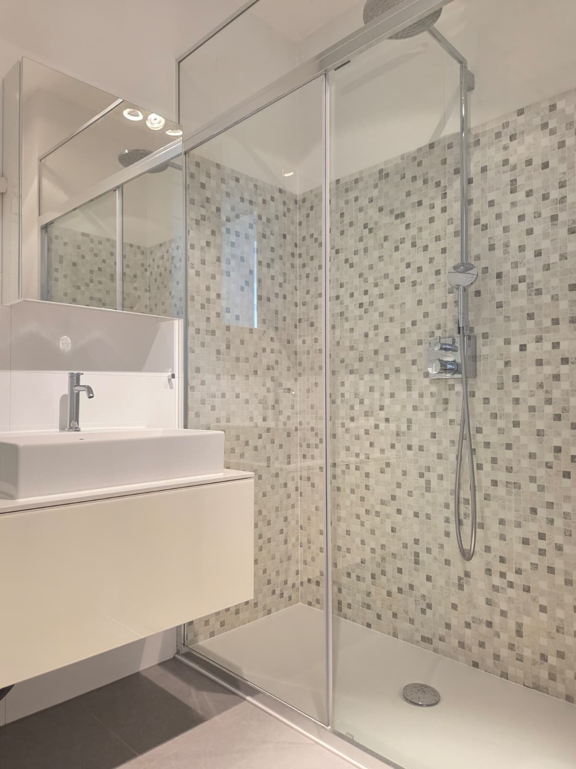 Bathroom sink and glass shower