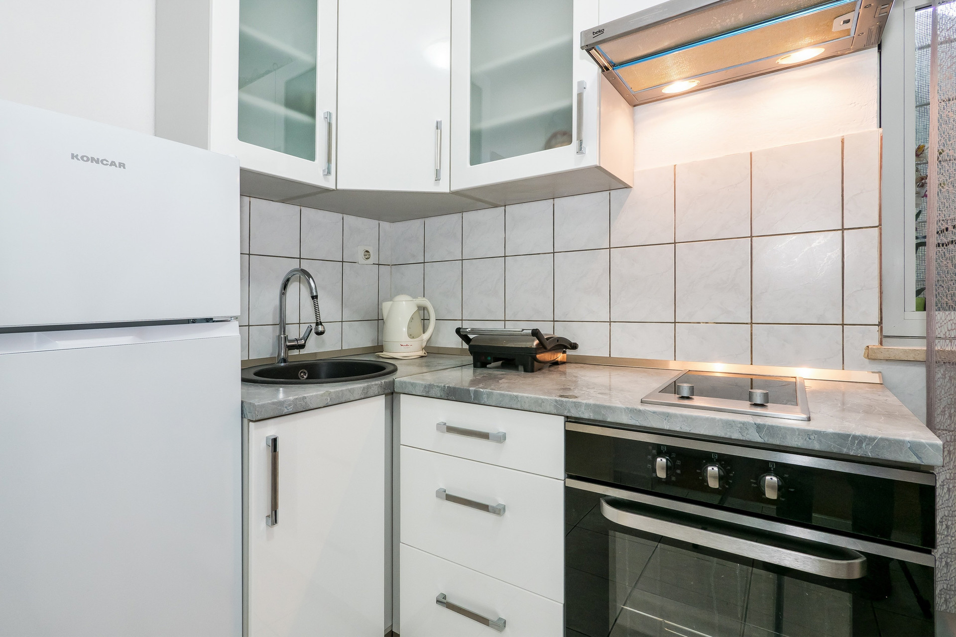 Compact kitchen with stove and sink