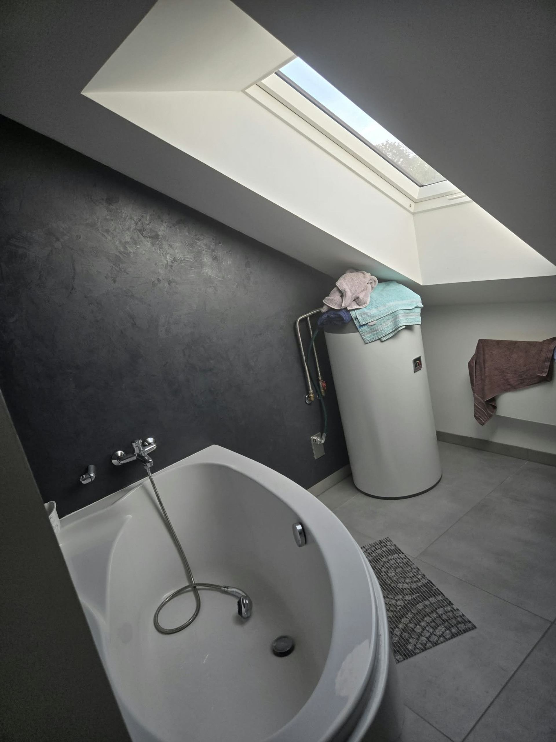 Bathroom with corner tub, skylight
