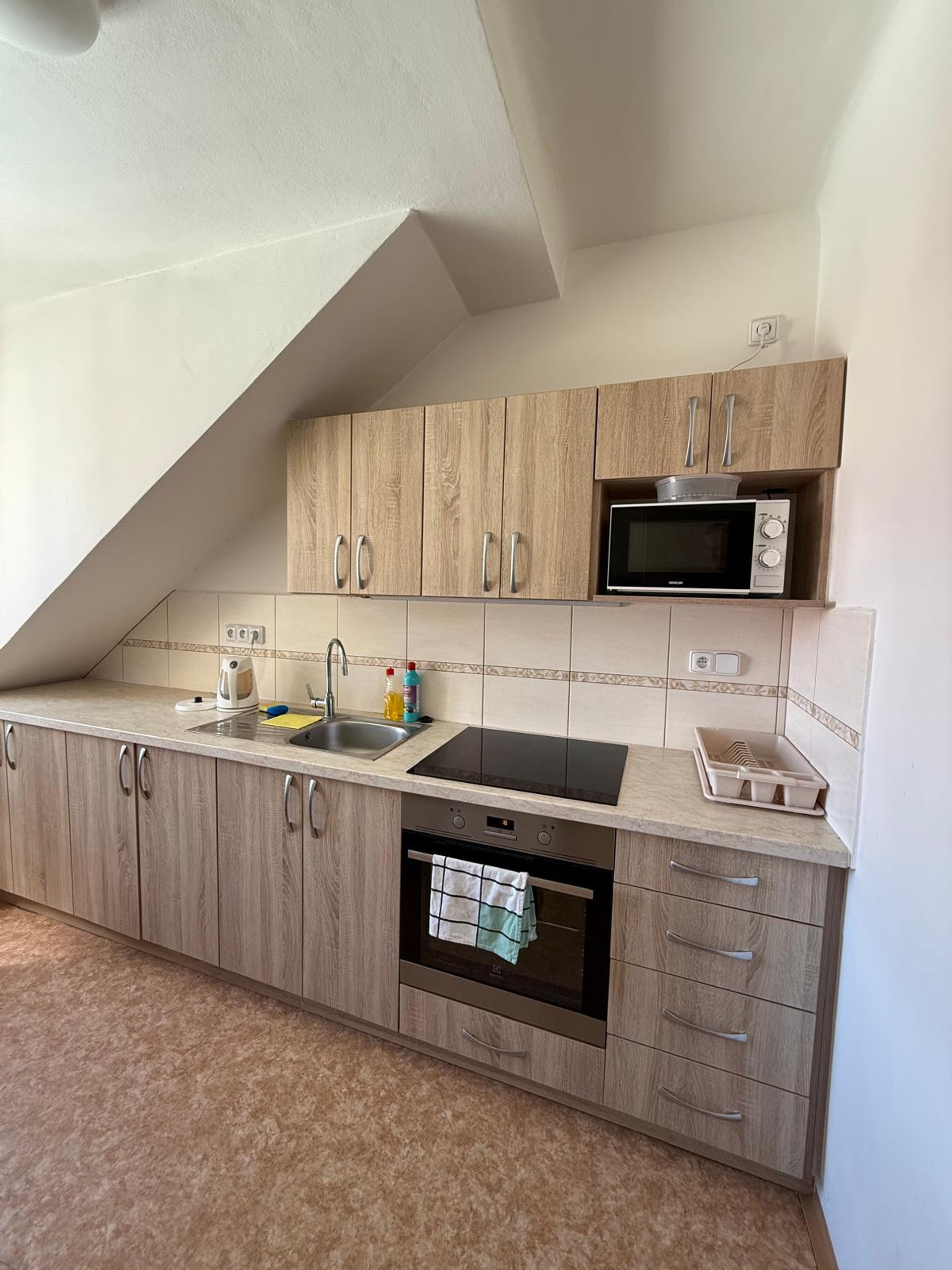 Kitchen with oven and microwave