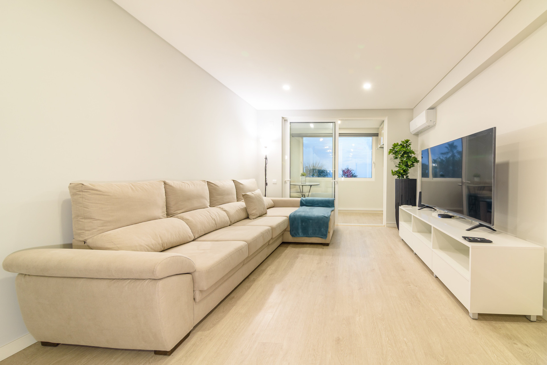 Bright living room with large TV