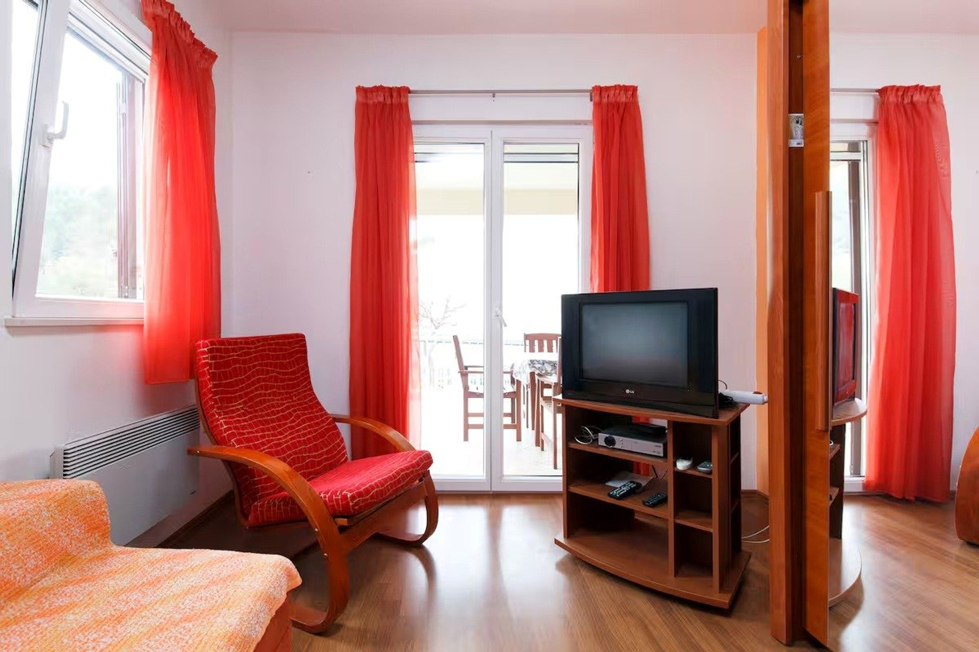 Living room with red curtains