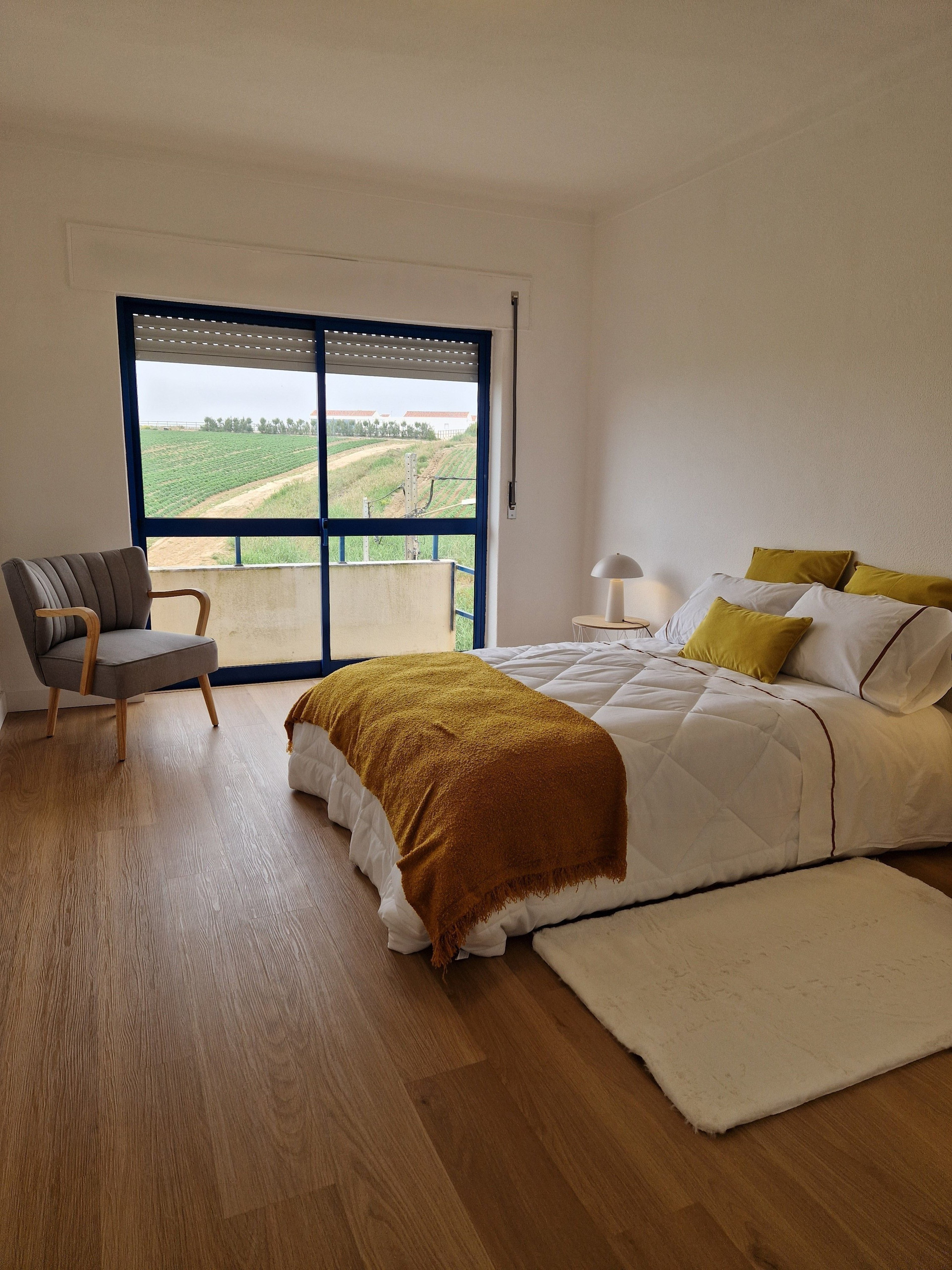 Bedroom with balcony countryside view