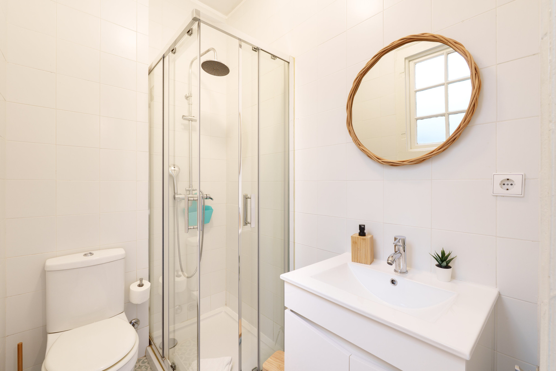 Clean white bathroom with shower mirror