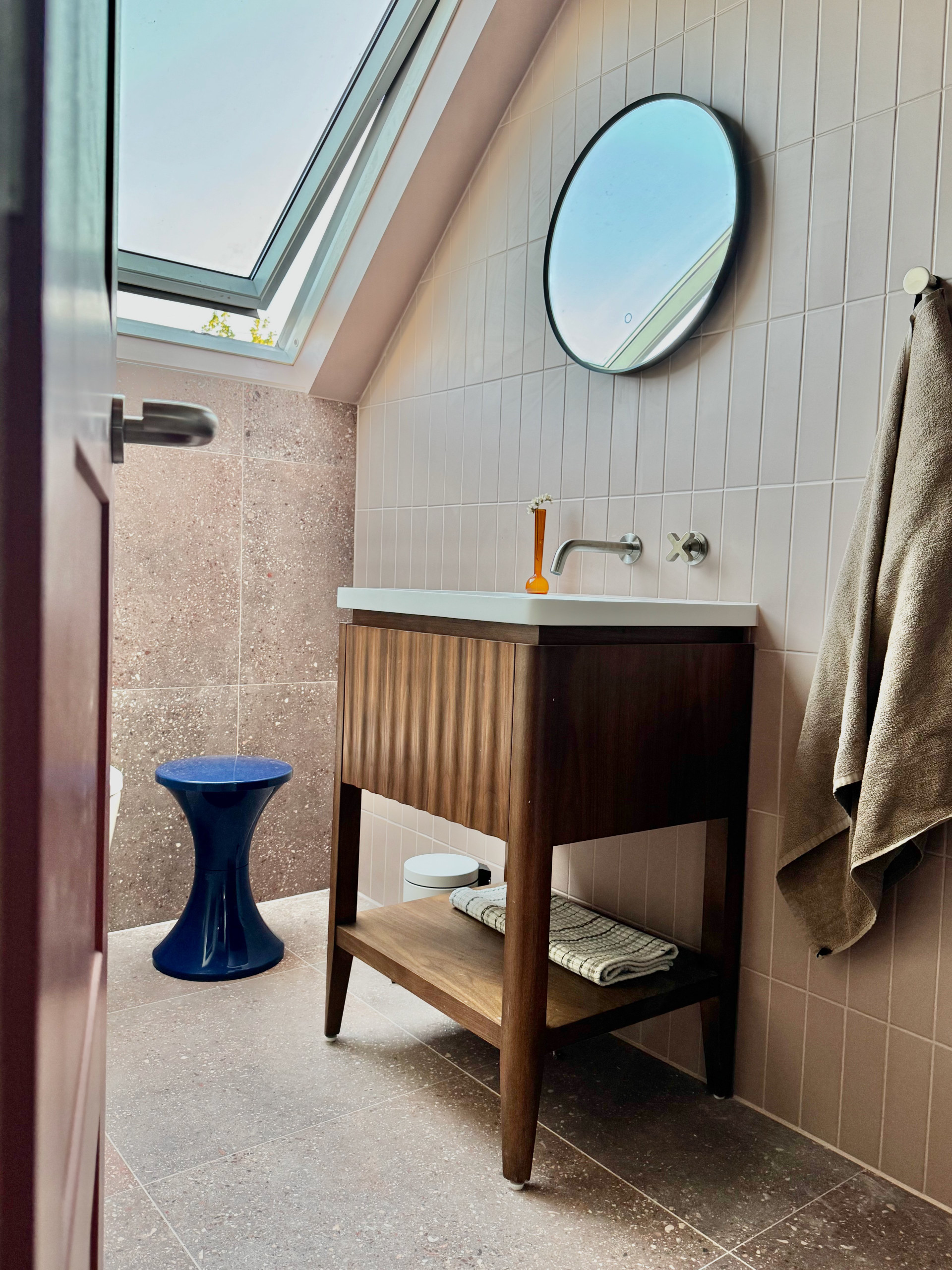 Bathroom vanity with round mirror