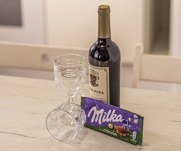 Wine and chocolate on table