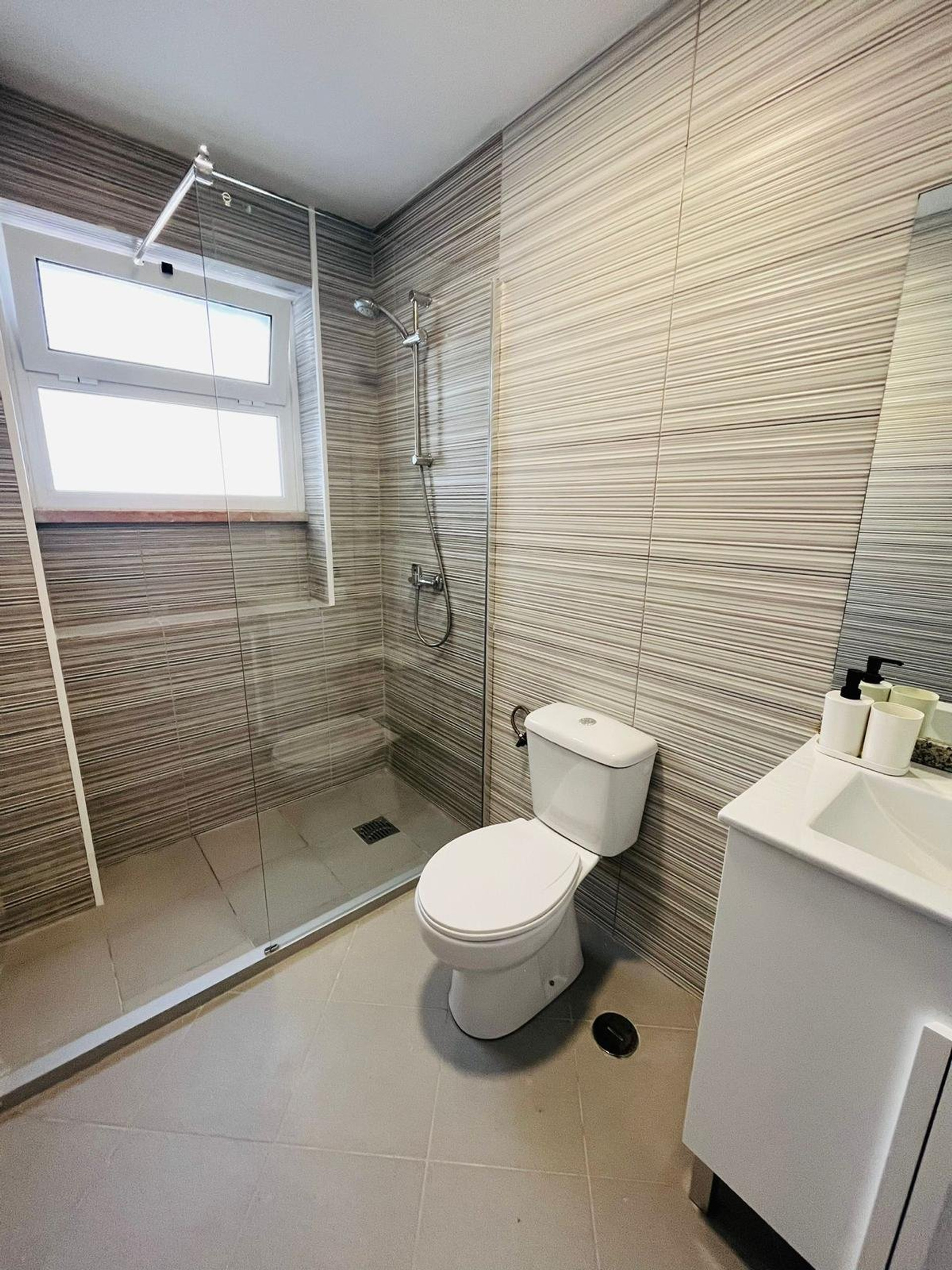 Bathroom with glass shower enclosure