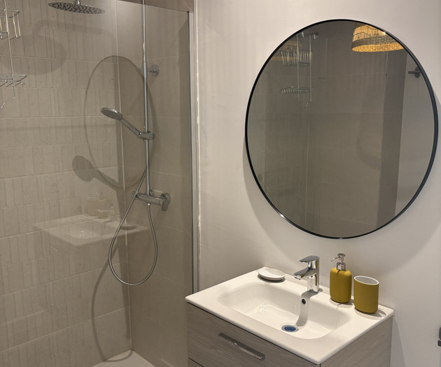 Bathroom with mirror and sink