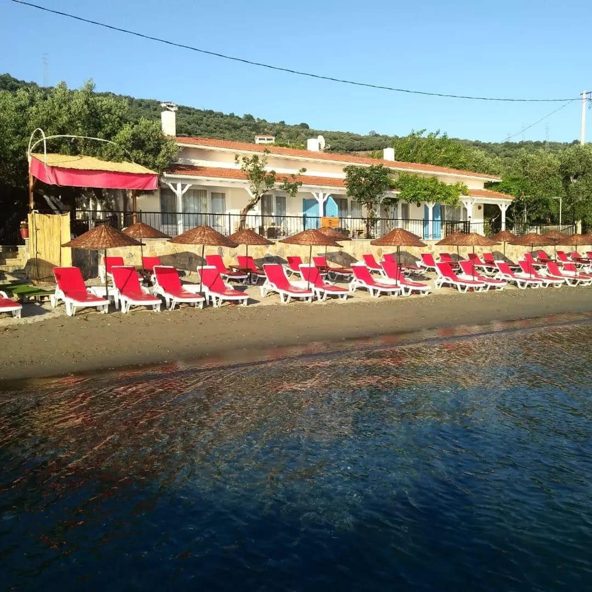 Beachfront property with sun loungers