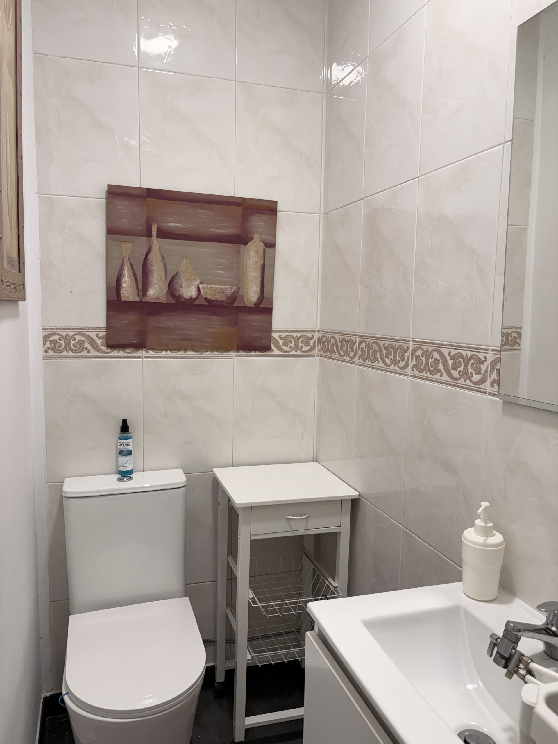 Bathroom with toilet sink tiles