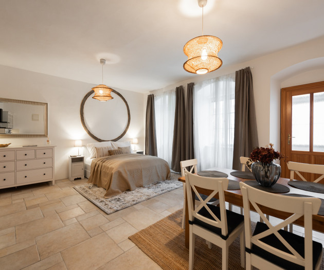 Bedroom with dining table nearby