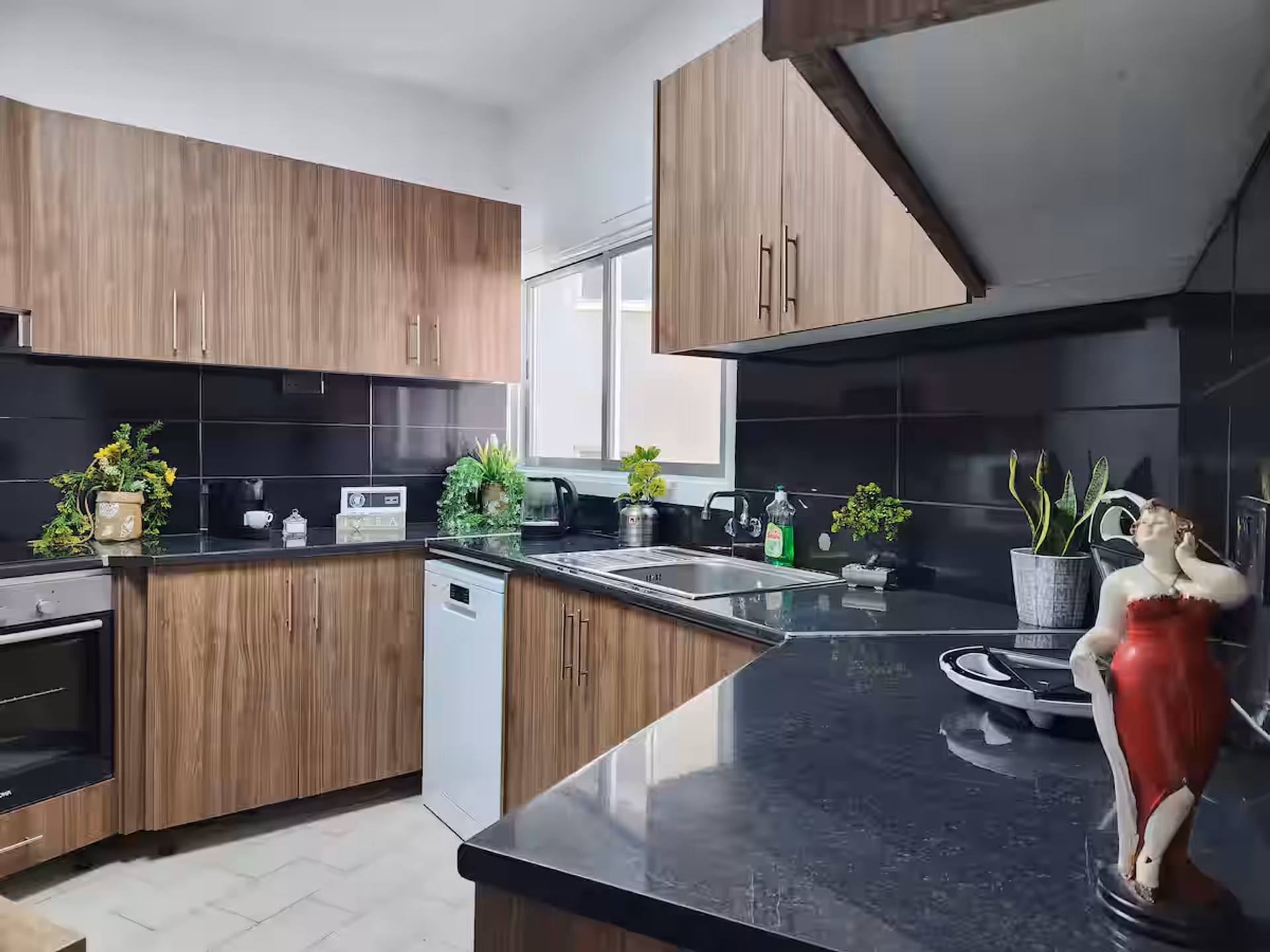 Spacious kitchen with dark countertops