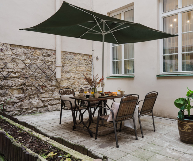 Outdoor dining under umbrella