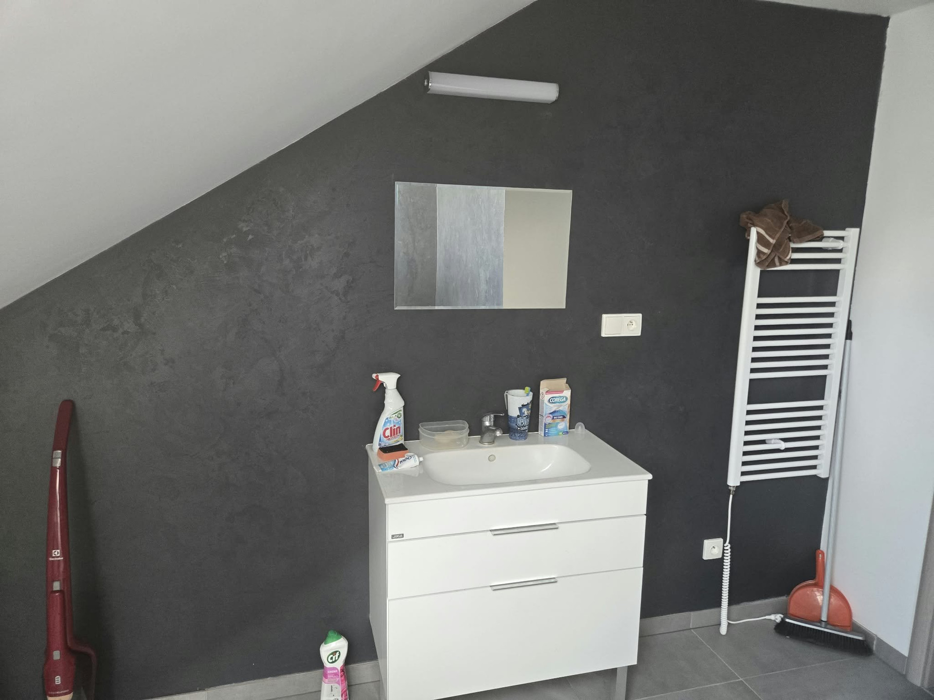 Bathroom vanity with heated towel rail