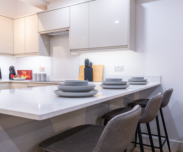 Kitchen counter with bar stools