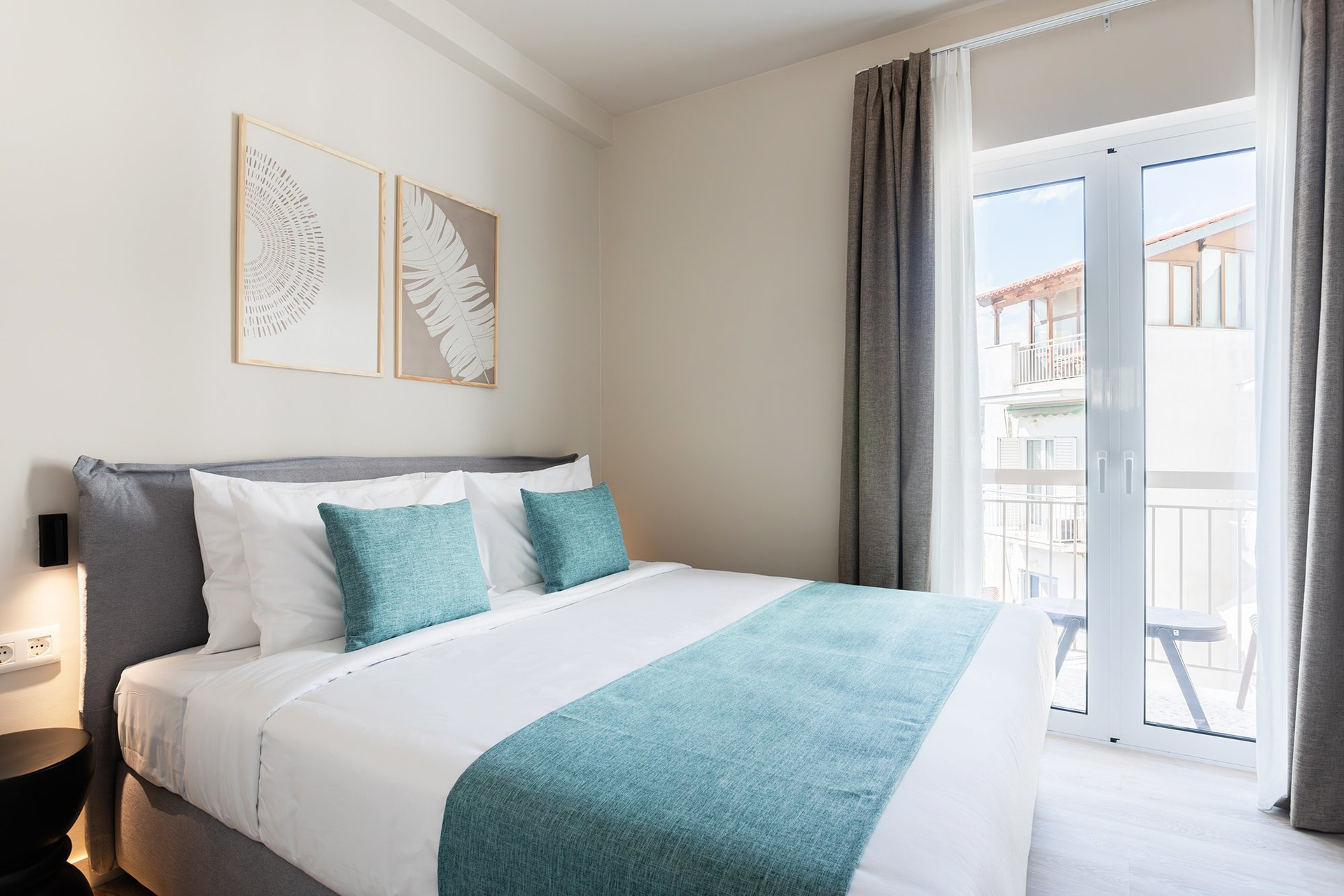 Bedroom with double bed and balcony