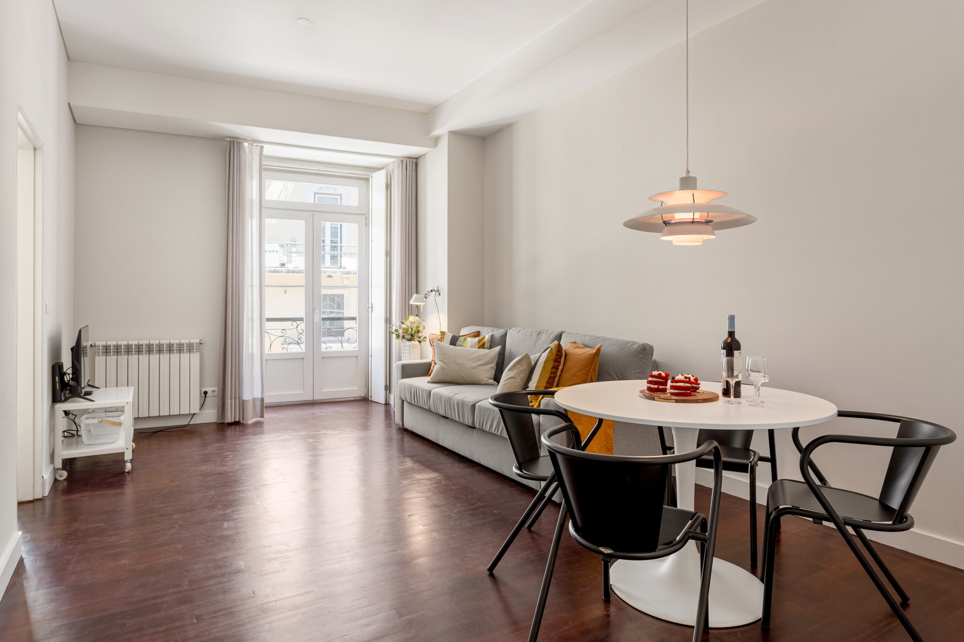 Living Room with Sofa, TV and Dining Table