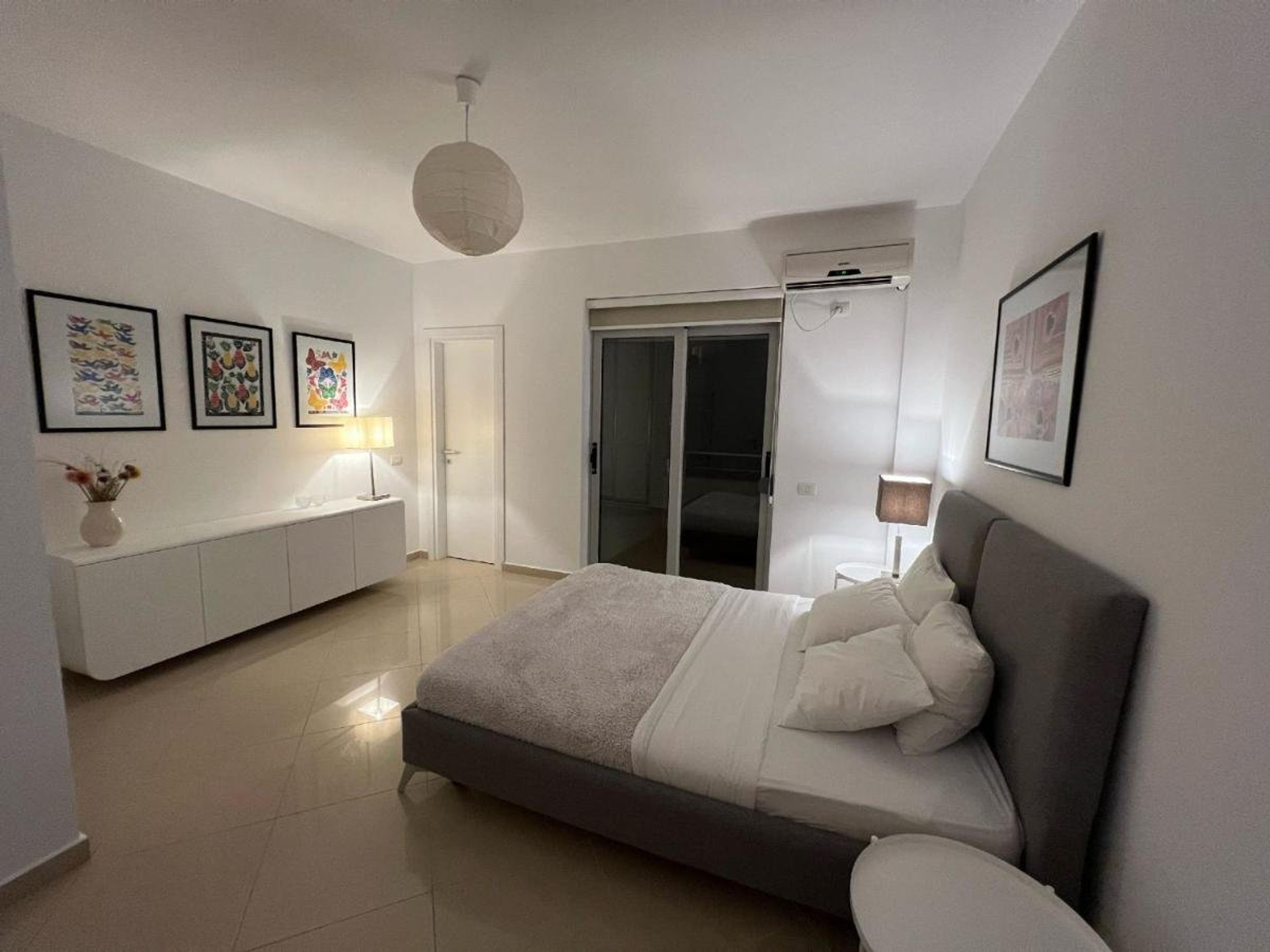Bedroom with double bed, sideboard