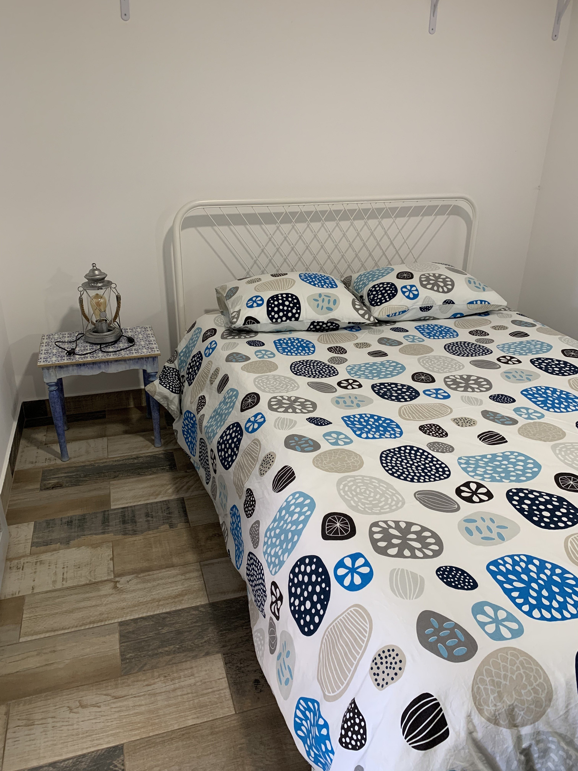 Double bedroom with patterned bedding