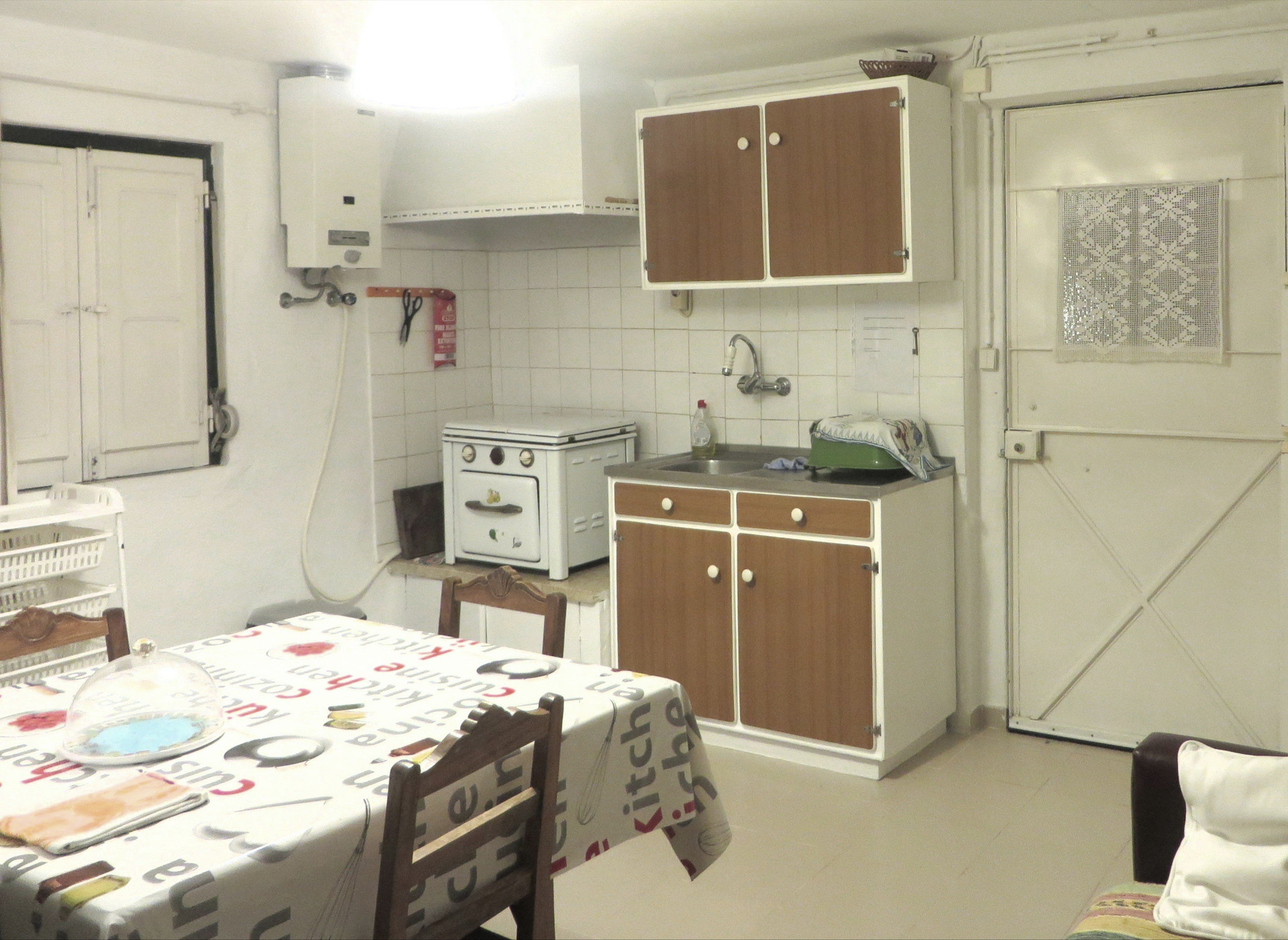 Kitchen with dining table and stove
