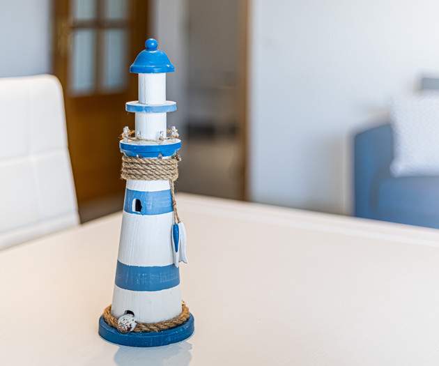 Decorative lighthouse ornament on table