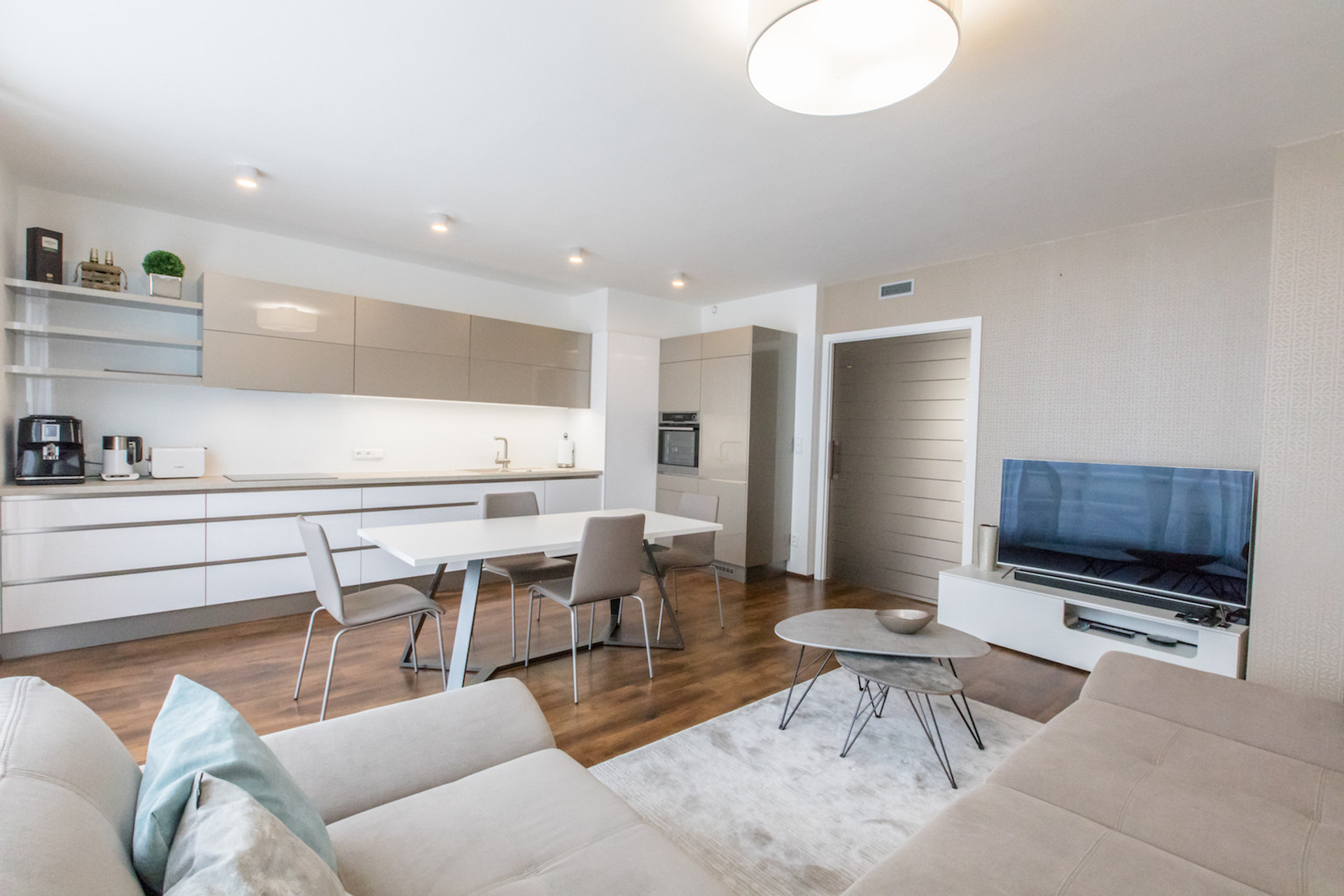 Kitchen & Living room with direct access to the terrace oriented to the South. All windows within the apartment have installed electric blinds.
