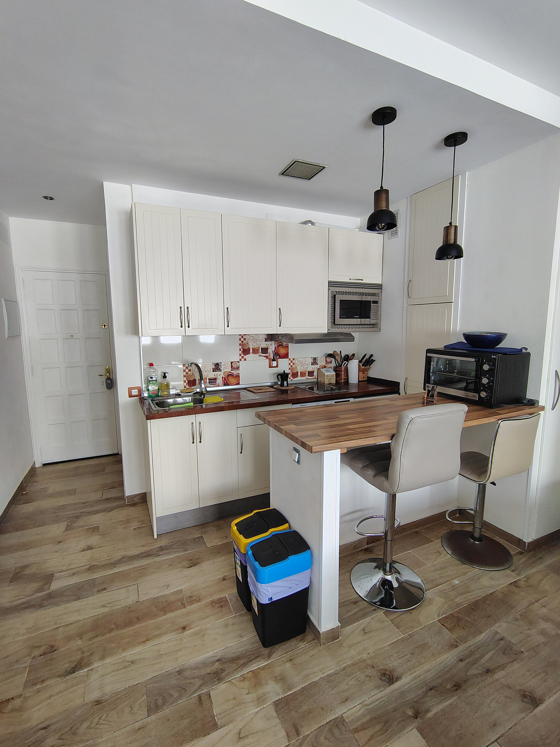 Kitchen with bar stools and counter