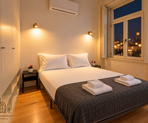 Bedroom with grey throw, city view