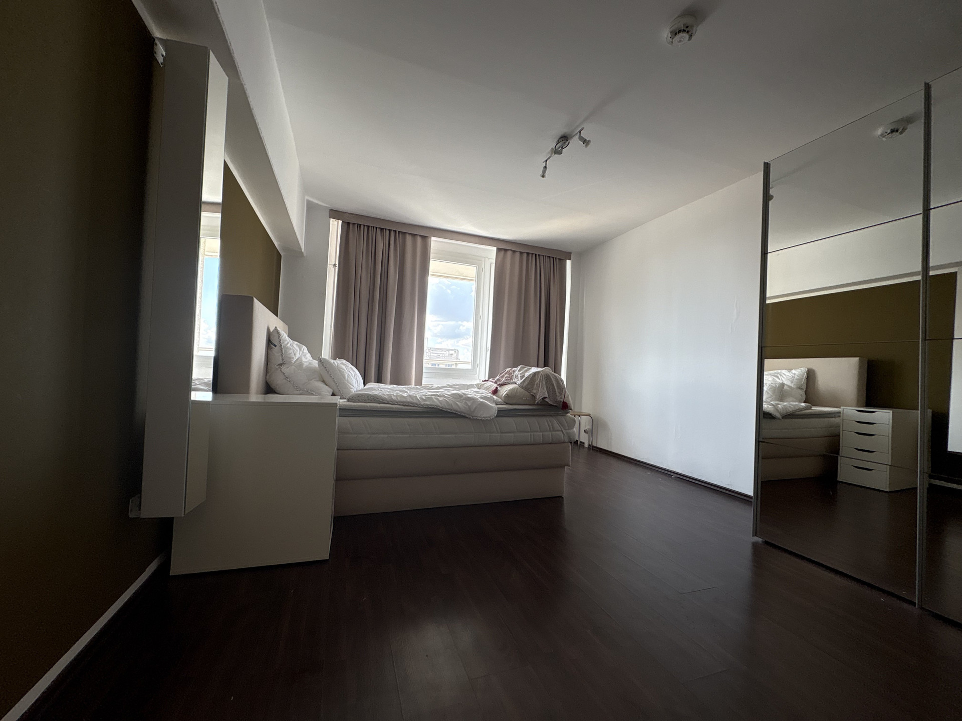 Bedroom with mirrored wardrobe